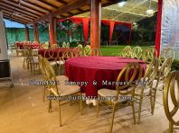 Round table with gold channel chair