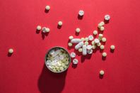 elevated-view-pills-container-red-background